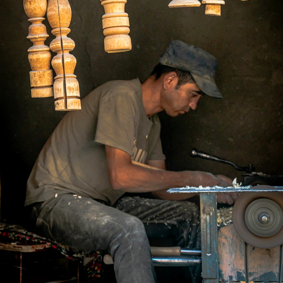 A craftsman working carefully in his workshop
