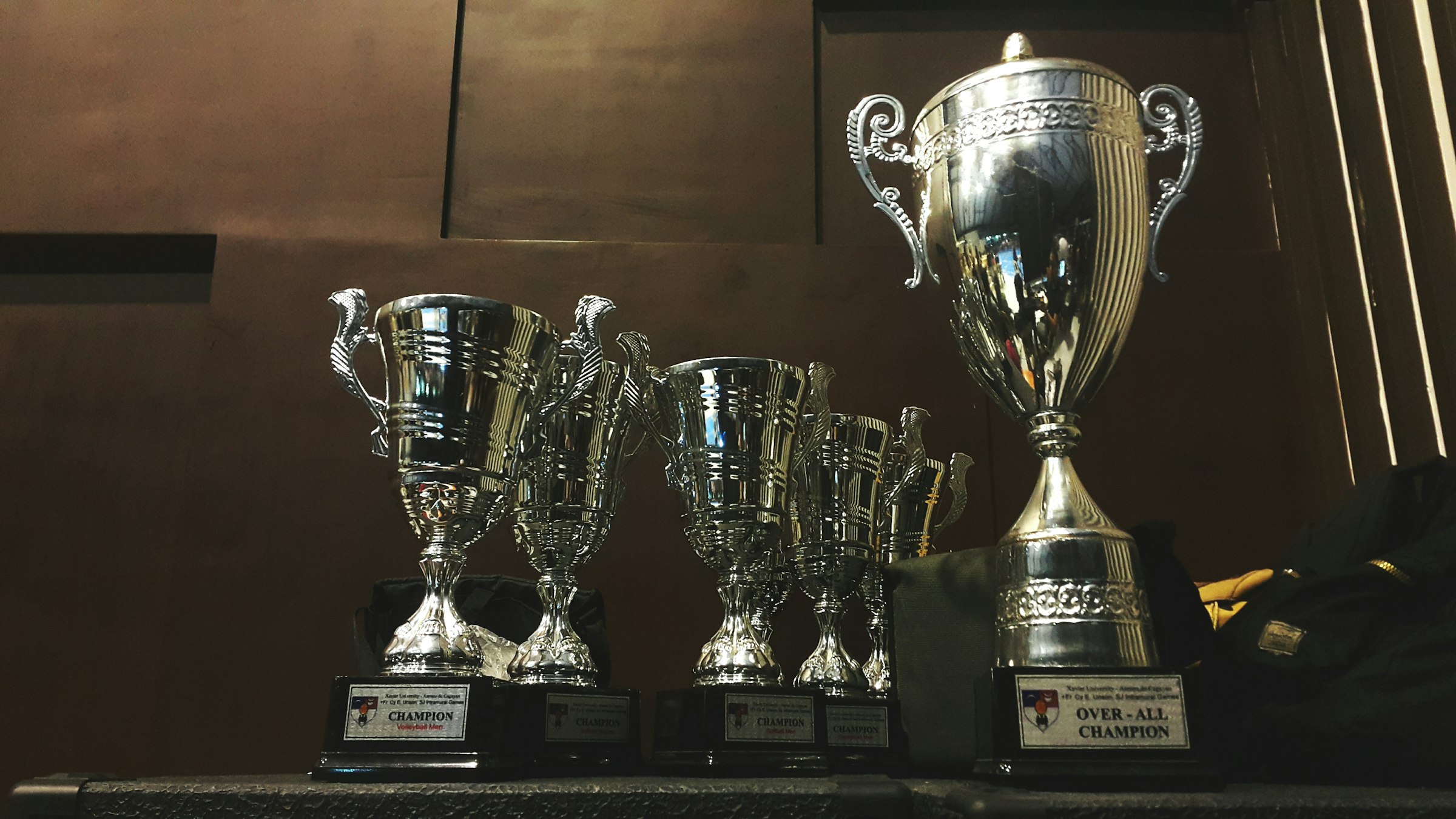 Trophies and awards on a wooden surface