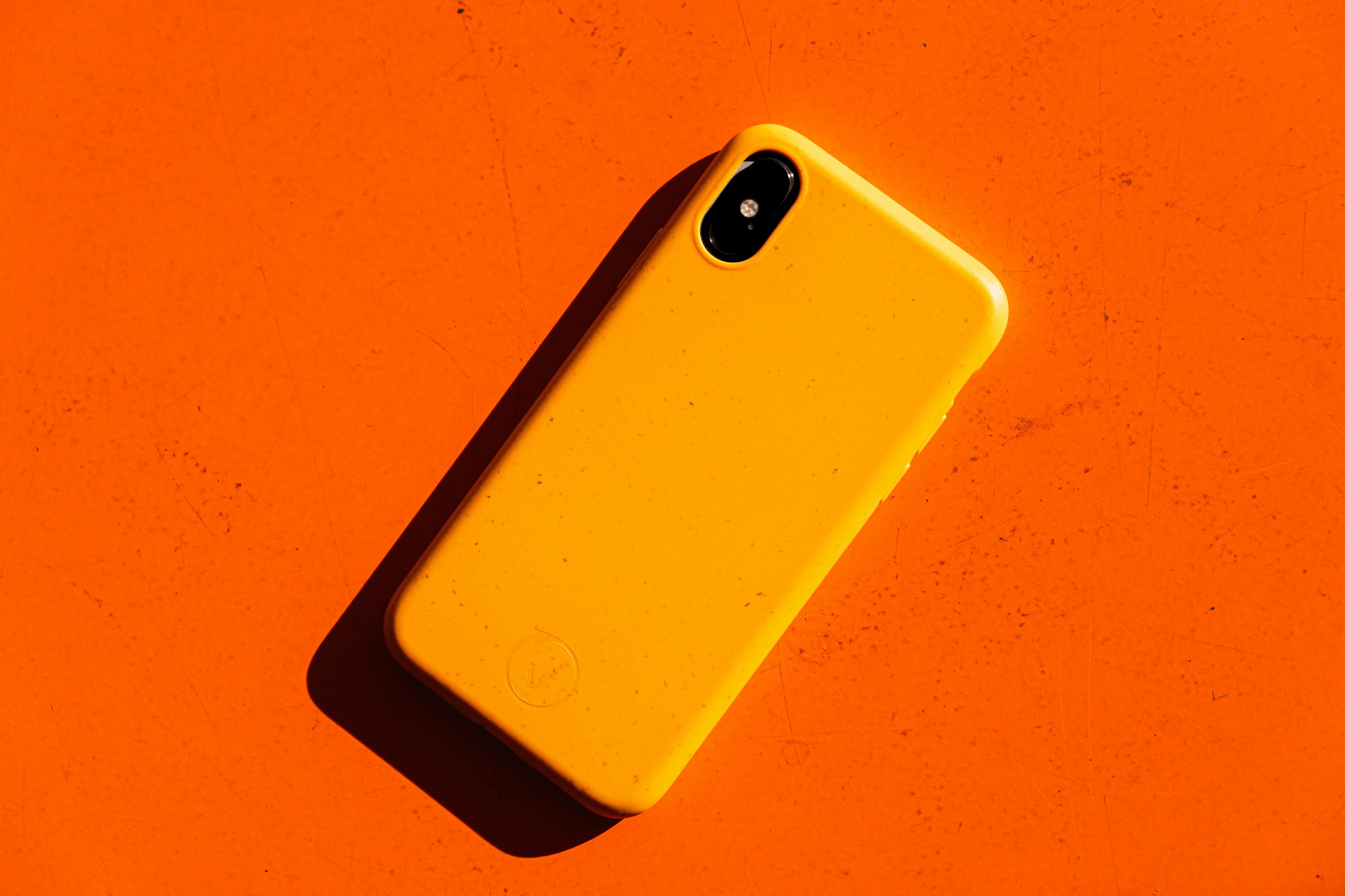Bright phone cover on an orange background